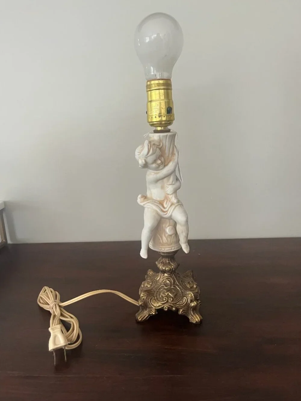 vintage cherub lamp with brass base